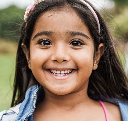 child smiling - visit a children's dentist near me